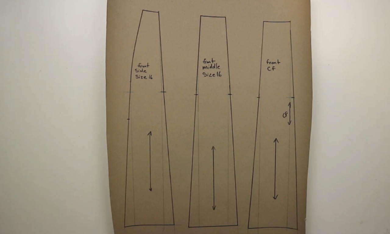 The three front panels of a hand-drafted skirt pattern, laid out on brown paper and labeled 'front side,' 'front middle,' and 'front CF'.