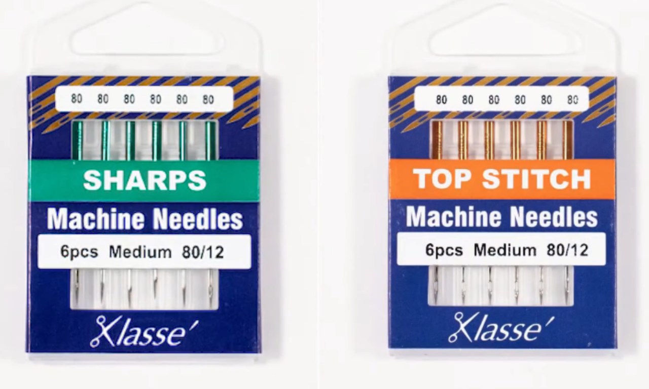 Two packs of Klasse' brand sewing machine needles, size 80/12, showing a pack of Sharps needles next to a pack of Top Stitch needles.