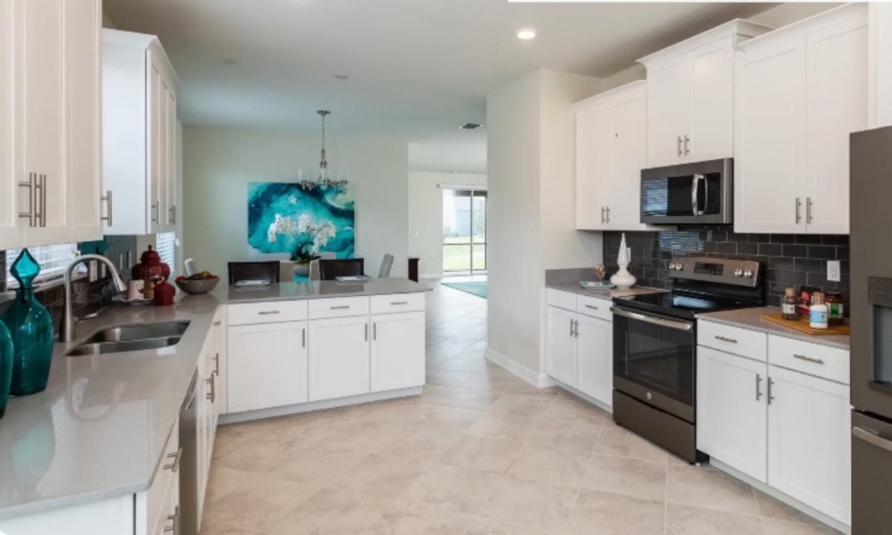 Soft-close hinges installed on white kitchen cabinets