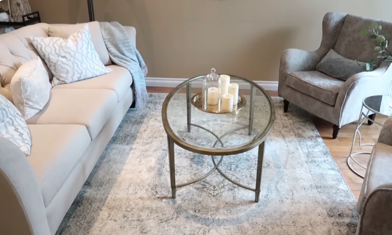 Living room layout with furniture anchored on a large area rug