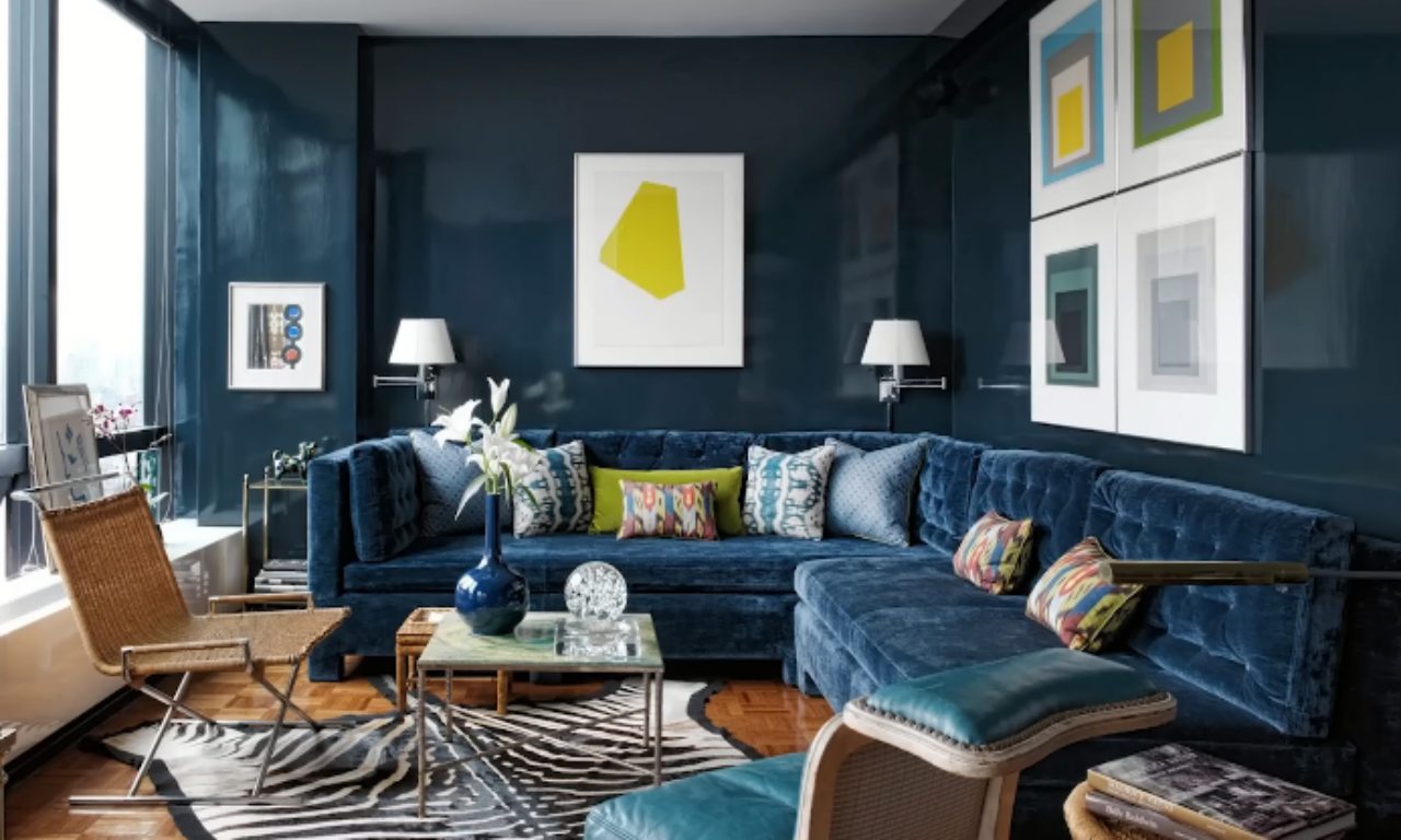 A dramatic dark living room showing how bold color can work in a space with fold-away or adaptable furniture