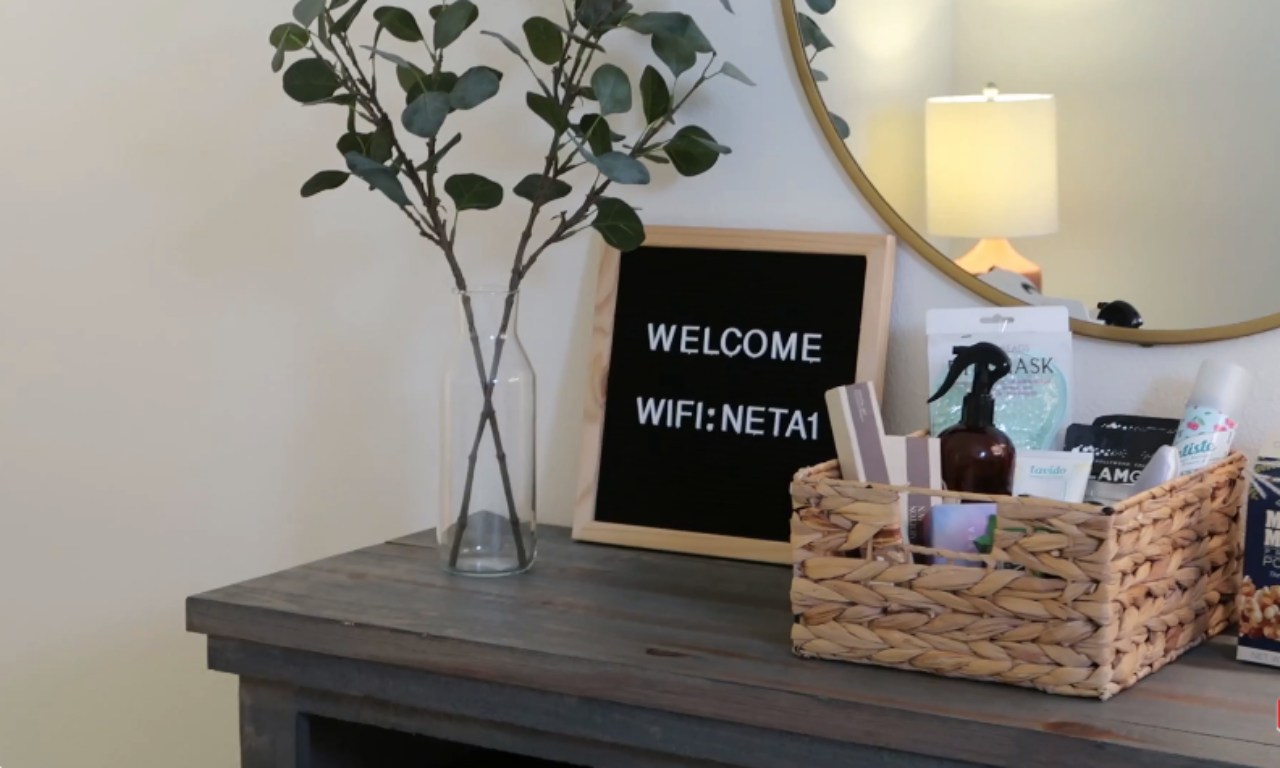 Thoughtful guest room amenities on a wooden dresser