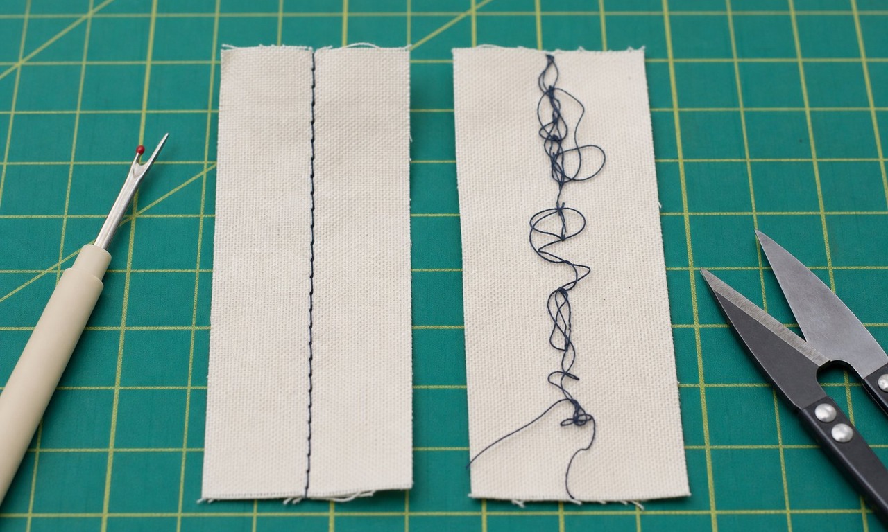 Two fabric stitch samples side by side on a cutting mat, one showing balanced stitches and one showing loops of bobbin thread on the upper face